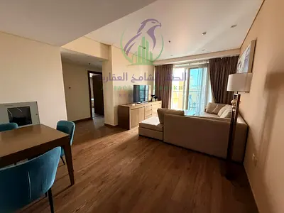 شقه مفروشه غرفتين وصاله للايجارالسنوى فى منطقة التعاون الشارقه برج فندقى راقى جيم ومسبح وباركن مجانى خزائن بالحائط مساحات واسعه