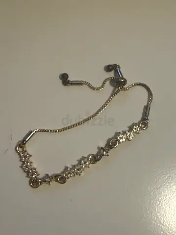 Delicate silver-golden tone adjustable bracelet with crystal accents