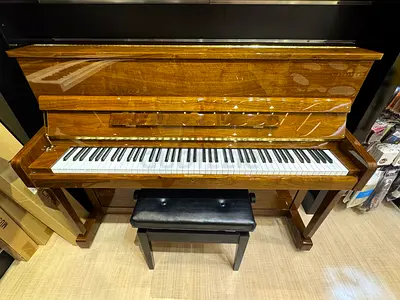 Upright acoustic piano in good condition with bench