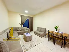 For monthly rent in Ajman, two-bedroom apartment with a balcony open view, fully furnished with eleg