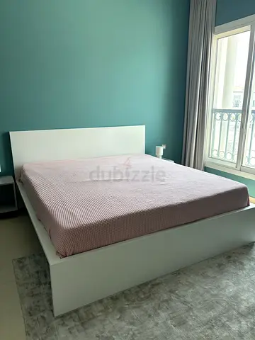 White wooden King size bed frame with headboard