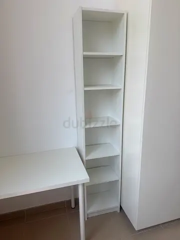 Narrow white shelving unit with 6 cubbies - good condition