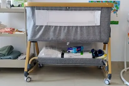 Portable bedside bassinet with storage shelf - grey