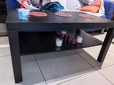 Dark Wood Coffee Table with Lower Shelf - blue sofa