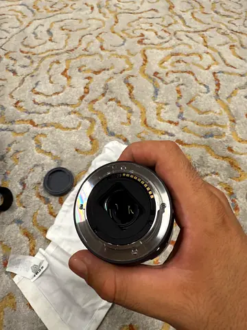 Used interchangeable camera lens with rear cap (good condition)