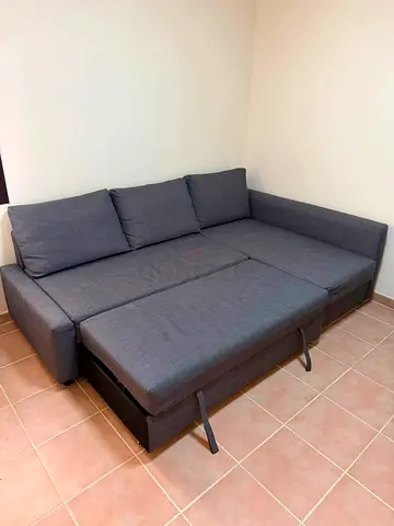 Grey L-shaped sofa bed with storage - good condition