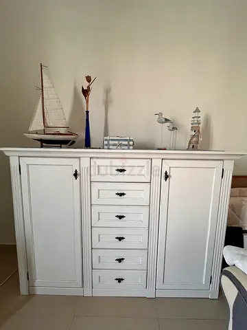 White wooden storage cabinet with drawers