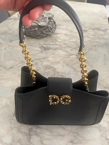 Original Dolce & Gabbana Black leather shoulder bag with gold chain strap and decorative clasp