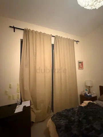 Beige fabric curtains with curtain rod - used, good condition