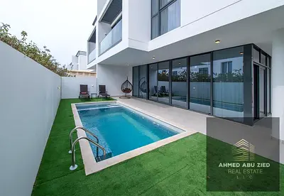 Luxurious furnished villa in Ajmal Makan, Al Hamriyah: smart home, pool, garden, 5 master beds, 7 baths, covered parking. AED 200k/yr.