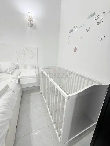 IKEA White wooden baby crib / cot in good condition