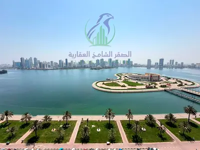 Four Bedroom Apartment and Living Room for Annual Rent in Al Majaz 3 Sharjah Free Maintenance Free Air Conditioning and Parking Balcony with Open Sea