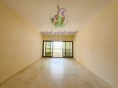 Three Bedroom Apartment for Annual Rent in Sharjah Spacious Layout Master Bedroom Two Large Hallways Built In Wardrobes Balcony Open View