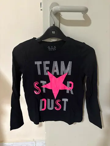 Black long-sleeve kids girls top with pink star 'Team Stardust' graphic -