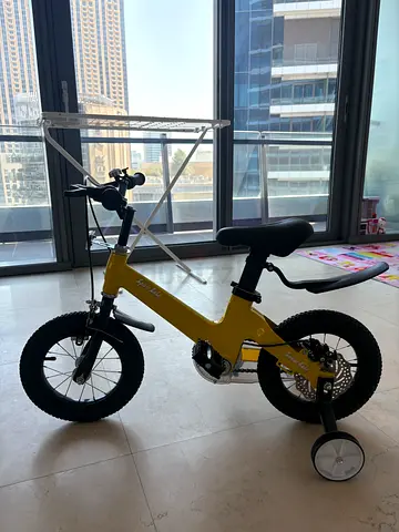 Yellow kids balance bike with training wheels (good condition)