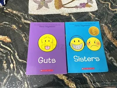 Guts & Sisters by Raina Telgemeier — Set of 2 Graphic Novels (Good Condition)
