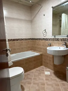 Master bedroom with attached bathroom and window relaxing See view