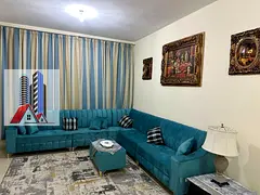 Furnished 2-bedroom apartment with living room for monthly rent in Ajman One Towers - Al Rashidiya I