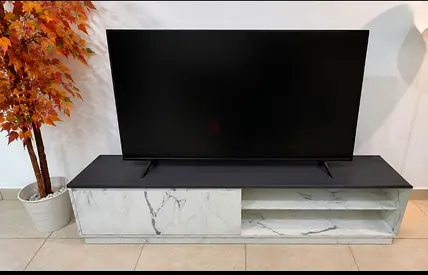 Low-profile marble-effect TV cabinet with sliding door - good condition