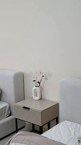 Modern ribbed bedside table / nightstand in neutral beige