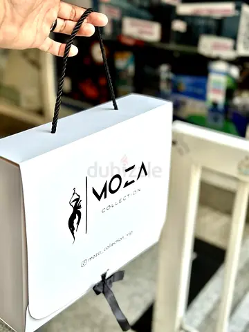 MOZA Collection white branded gift/shopping bag with rope handles
