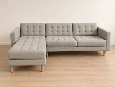 Light grey L-shaped fabric sofa with chaise - good condition