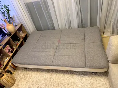 Compact grey fabric sofa bed — good condition