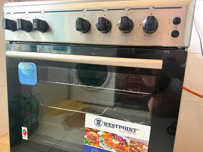 Westpoint. Stainless-steel 4-burner Gas Cooker with grill and fan.
