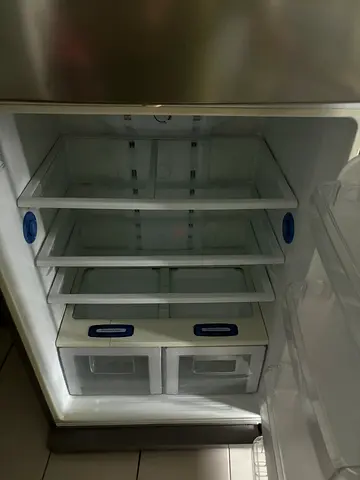 Used Samsung double-door refrigerator - clean and functional interior