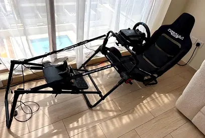 Full setup racing simulator with wheel, pedals and seat