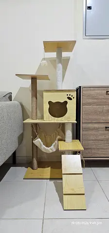 Wooden multi-level cat tree with hammock and scratching posts