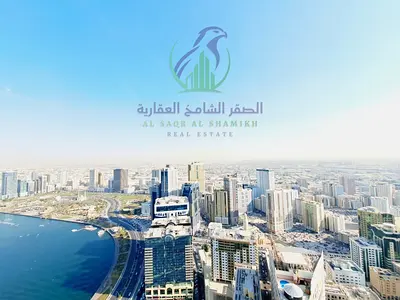 أفخم شقة ثلاث غرف وصالة في المجاز 3 على قناة القصباء مع شهر مجاني وإطلالة بحرية مباشرة وباركينج مجاني وجيم ومسبح