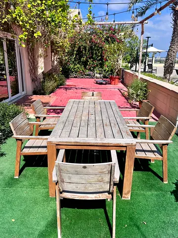 Outdoor wooden dining table with 8 chairs - weathered teak look