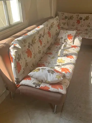 3-seater fabric sofa with floral cushions - good condition