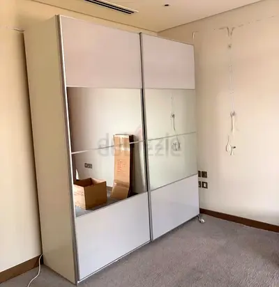 White sliding door wardrobe with mirrored panels – good condition