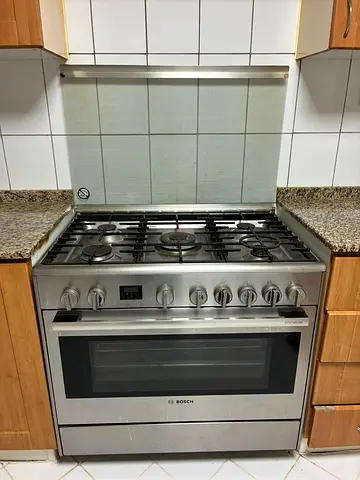 Urgent sale - Bosch stainless steel gas range with oven - good condition