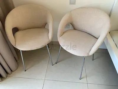 2 Cream Armchairs with Chrome Legs – AED 300 for Pair