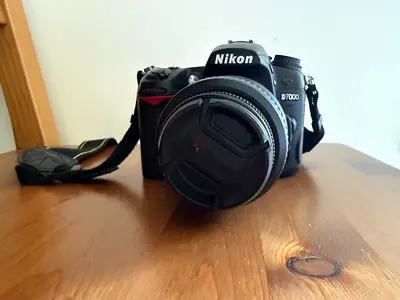Nikon D7000 DSLR body with 18-105mm kit lens (good working condition)