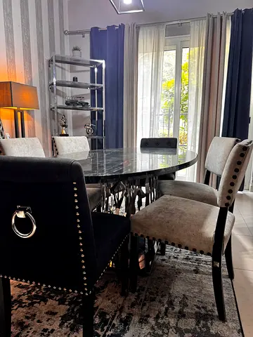 Marble-top dining table with 6 upholstered chairs - good condition