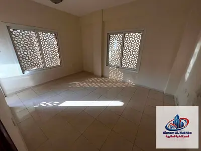 Near Corniche. Best price 1BR for rent in Al Majarra. Balcony, AC, central gas. Easy payment. Prime location, easy exit to Dubai.