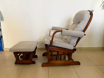 Rocking chair with rocking foot rest