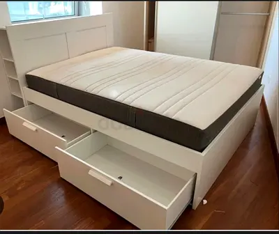 White storage bed frame with headboard shelves and mattress - good condition