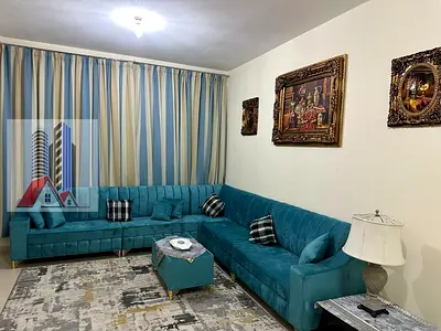 Furnished 2-bedroom apartment with living room for monthly rent in Ajman One Towers - Al Rashidiya Includes bills . Luxurious furnishings.