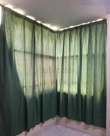 Green blackout-style curtains - pair, good condition
