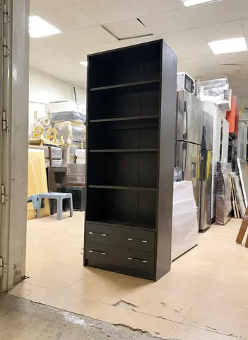 Tall dark wood bookshelf with 4 shelves and 2 drawers