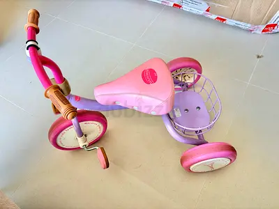 Pink toddler tricycle with small basket — used, good condition