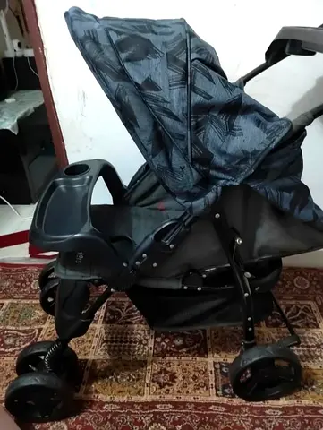 Juniors standard baby stroller with canopy and child tray