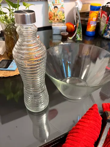 Glass water carafe and fruit or salad bowl