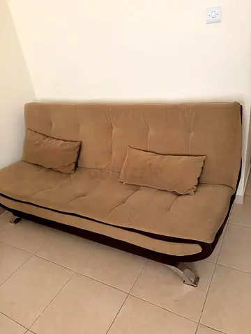 Beige brown convertible futon sofa bed with cushions