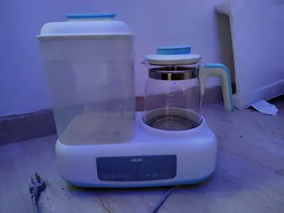Baby bottle sterilizer with kettle